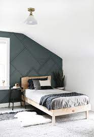 Add architectural interest on the wall behind the bed by applying wood panelling in a grid pattern. Diy Wood Trim Accent Wall