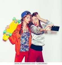 sporty girlfriends standing having fun together beautiful women making selfie emotion toned white background not isola photo editing have fun fitness logo