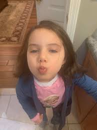 My sweet pea wearing her sweet pea!