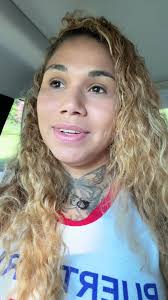 Person With Curly Blonde Hair in Vehicle Setting