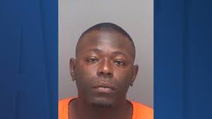 Homicide suspect barricaded inside motel room