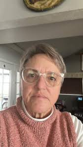 What short haircut style would suit a 62-year-old woman with silky smooth  and thick hair?