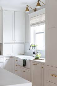 brass bamboo pulls on white shaker