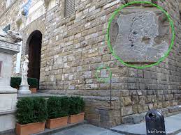 This is the city hall of florence since medieval times. Who Is The Mystery Man On The Wall Of Palazzo Vecchio