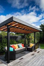 Sophisticated Coastal Retreat For A Young Family In Eastbourne New Zealand Outdoor Pergola Pergola Plans Modern Pergola Designs