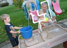 Sand Water Table Turned Into Endless Water Fun With Pvc Pipes Happyfamilysummer Sand Table Sand And Water Table Water Table Diy