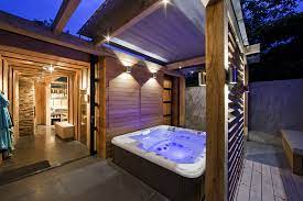 The natural hot tub design what makes this idea for a diy hot tub impressive is it's a hot tub put into the ground and finished out with a waterfall and stonework. Netherlands Wellness Centre With Luxurious Indoor Outdoor Spa Choices