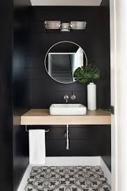 Photo about clean white bathroom sink with oral hygiene essentials, in foreground man drying his face using clean towel. Powder Room Palettes 10 Beauties In Black