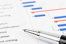 project management and gantt chart with pen