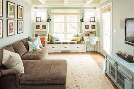Love Everything About This Cozy Living Room Including The Two Desks Flanking The Window Seat Ho Narrow Living Room Long Narrow Living Room Long Living Room