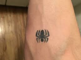 Another example of the ripped skin tattoos, but this is a sleeve design. My Brother C Has This Tiny Spiderman Logo I Got A Bigger Version Myself Spiderman Tattoo Small Hand Tattoos Geek Tattoo