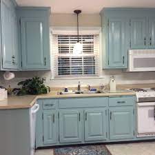 Because the rest of this kitchen by côté maison is minimal in color and structure, the teal paint used on the walls is rich and dramatic—not overwhelming. Aqua Painted Kitchen Cabinets Aqua Kitchen Teal Kitchen Cabinets Diy Kitchen Renovation