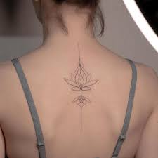 This simple tattoo is of an anchor on the back of the woman's neck. Simple Tattoos Idea For Girls And Their Meaning Tikli