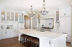 Chic antique style kitchen cabinets of wooden materials in white and cream. 30 Beautiful White Kitchens Design Ideas Designing Idea