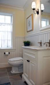 The vanity and shower curtain introduce splashes of bright colors, but the white beadboard paneling is a gentle, grounding touch that keeps the scheme from getting too busy. 50 Yellow Tile Bathroom Paint Colors Ideas Roundecor Beadboard Bathroom Bathrooms Remodel Half Bathroom Remodel