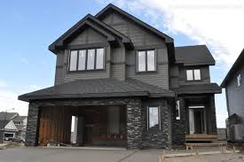 For more classically styled homes, white is a traditional accent for window trim, pillars, and doors. Google Image Result For Http Www Bumpyroadtohome Com Wp Content Uploads 2011 10 Dark Gray House Exterior House Paint Exterior Exterior Paint Colors For House