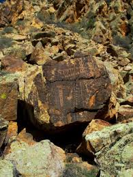 Parowan gap petroglyphs several centuries ago native americans traveling through the area stopped and pecked designs onto the smooth faces of large boulders found on the east side of the gap. Parowan Gap Petroglyph Site And Dinosaur Tracks