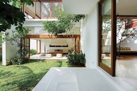Here is an example of an interior home design in sri lanka of a wooden living room, which is designed with an outdoor lanai. Lalith Gunadasa Architects Reimagines Vernacular Sri Lankan Courtyard In Modern House De51gn