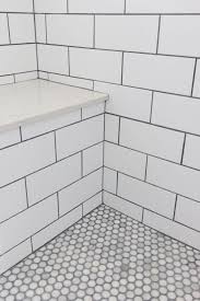 Master Bathroom Shower Subway Tile With Grey Grout Stone Bench And Penny Round In 2020 Bathroom Shower Tile Penny Tiles Bathroom Master Bathroom Shower