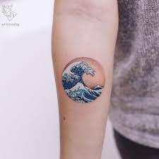 Japanese wave tattoos can be adapted to many body parts. Riding The Rip Tide Hokusai S Great Wave Tattoos Tattoodo