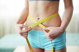 See full list on wikihow.com Female Waist With Measuring Tape Around Stock Photo Dissolve