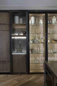The Bar Is Housed In Custom Designed Cabinetry Which Combine A Specially Fabricated Steel F Luxury Kitchen Modern Crockery Cabinet Design Crockery Unit Design