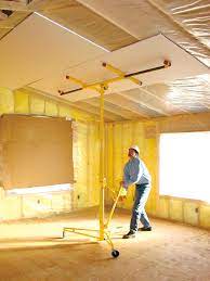 The finished side of the drywall should face down. How To Install Drywall Ceilings Drywall Installation Drywall Ceiling Drywall Lift