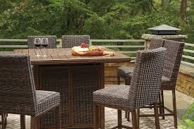 These table sets make the perfect addition to cafes, hotels, restaurants, and university campuses looking to expand their outdoor dining options. Paradise Trail Outdoor Fire Pit Bar Table Set By Signature Design By Ashley Furniturepick