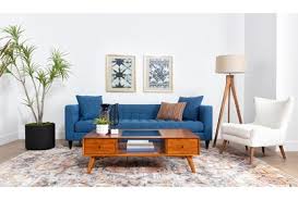 На кофейном столике чашка кофе. Alton Coffee Table Living Spaces