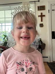 Little miss Katie sitting in the bus pretending to talk