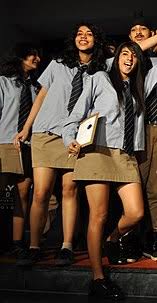 Uniforms that include an apron for girls may suggest that the appropriate feminine societal role is a primarily domestic one. School Uniforms By Country Wikipedia