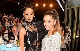 Rihanna poses for photos backstage at milk studios on october 29, 2014, in hollywood, california. Ariana Grande Pleads With Rihanna To Drop Her Album After Breaking Streaming Record