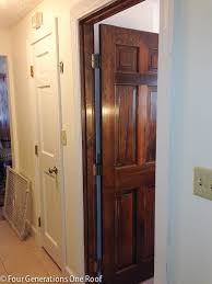The paint color is a warm dark gray with a hint of brown in it. How To Paint Dark Stained Doors Before After Four Generations One Roof