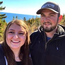 What could be causing a surging idle issue with a new carb