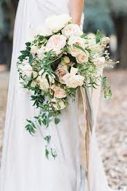 Your bouquet deserves baseballs, buttons, and butterflies. Feature Image By Lucy Davenport At Clovelly Village Flowers By Garden Wild The Style Of Your White Wedding Bouquets Wedding Bouquet Ribbon Wedding Flowers