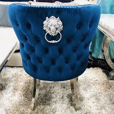 The chair is upholstered in a luxurious velvet look fabric which is soft to the touch. Diana Wide Blue Velvet And Chrome Dining Chair With Lion Ring Knocker Picture Perfect Home