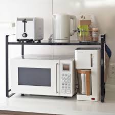 Simple And Stylish Kitchen Organizer Rack From Yamazaki It S Expandable And Goes Around The Micro Portable Kitchen Kitchen Organizer Rack Microwave In Kitchen