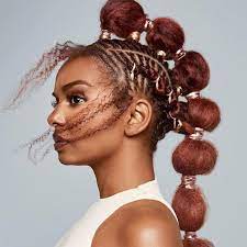 If i'm just going to wear it in a ponytail or bun all day, i rake a li and then a gel through my hair, and then comb it up into a ponytail. 10 Curly Ponytail Styles To Try Next Naturallycurly Com