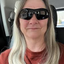 Who is the ghostly woman in white in Santa work shop?