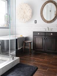 one of our local clients is replacing all of her downstairs floors this fall and requested a porcelain wo wood tile bathroom modern bathroom tile wood bathroom
