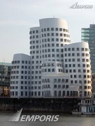 Completed in 1998, each building is coated in a different material: Neuer Zollhof 3 Dusseldorf 109920 Emporis