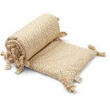 Learn about the risks of crib bumpers and hear from experts about why you should consider these crib bumper alternatives and are you considering purchasing a crib bumper for a baby on the way? Konges Slojd Crib Bumper Buttercup Yellow Rocket Toys