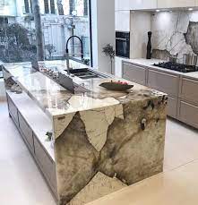 As the modern kitchen design has evolved over the years, certain features have remained relatively the same with clean lines, sleek appliances, and an overall simplistic feel. Patagonia Granite Countertops Luxury Kitchen Island Stone Countertops Kitchen Kitchen Marble