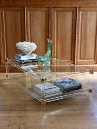 The shiny brass legs are softly curved and run perfectly into the lucite frame. Mid Century Lucite And Brass Coffee Table C 1970 S European Antiques