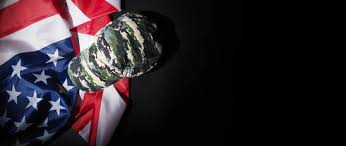 You may have seen that on a military uniform, the u.s. Military Hat Or Bag Laying With American Flag Soldier Hat Or Helmet With National American Flag On Black Background Represent Military Concept By Camouflage Object And Usa Nation Flag Indivstock
