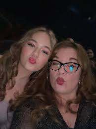 Introducing myself and sharing a photo from the ERAS Tour movie premiere