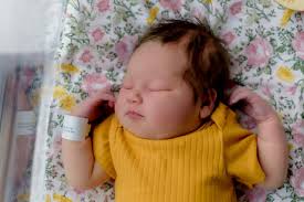 Her memory is growing worse. Her newborn photographer bailed. Enter a  stranger.