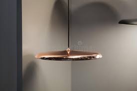 4.7 in d x 0.8 in h wire length: Modern Streamlined Mirror Copper Chandelier Metal Copper Disk Shaped Pendant Lamp Loft Style Stock Image Image Of Hanging Beautiful 155055623