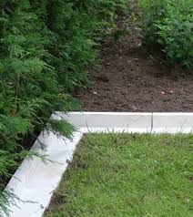 The first option is to create a rock moat barrier that's about a foot wide. Lawn Edging Haddonstone Gb