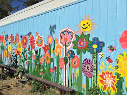 Ask students to bring their ideas and paint brushes to a blank wall. Denair Students Create Unique Garden And Beautiful Mural Garden Mural Garden Wall Art School Murals